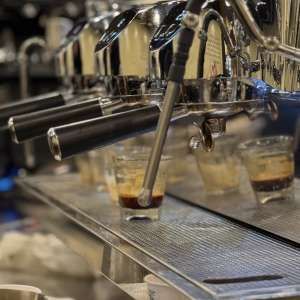 Shots of espresso pouring from the machine