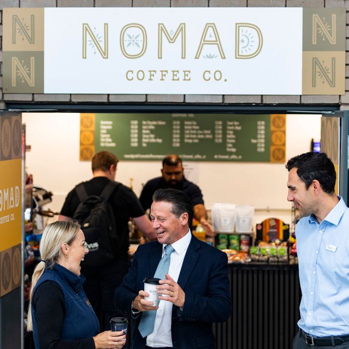 Cat sharing a laugh with Nigel Huddleston MP outside the Parkway café